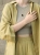Women’s silver jewelry with nephrite gemstone.