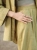 Silver signet ring with nephrite styled on a model’s hand.