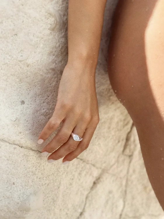 Women’s adjustable silver ring with milky opal from Poland.
