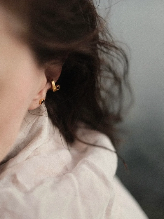 Delicate amber stud earrings styled for everyday wear