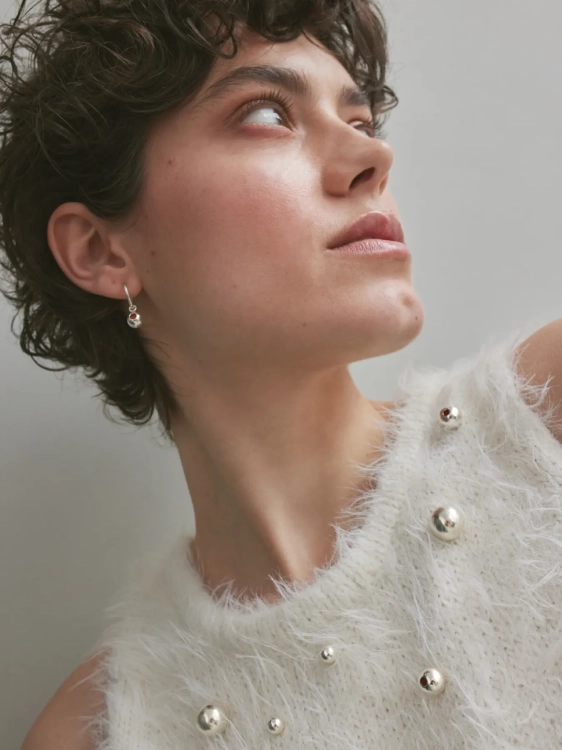 Sculptural silver hoop earrings with Baltic amber detail