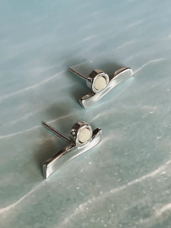 Sterling silver wave earrings with milky amber inspired by the sea