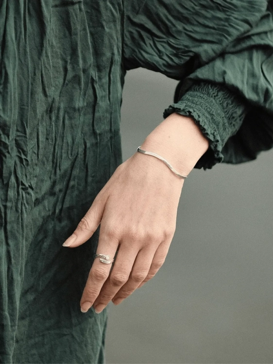 Delicate silver wave ring with amber as a personal accent