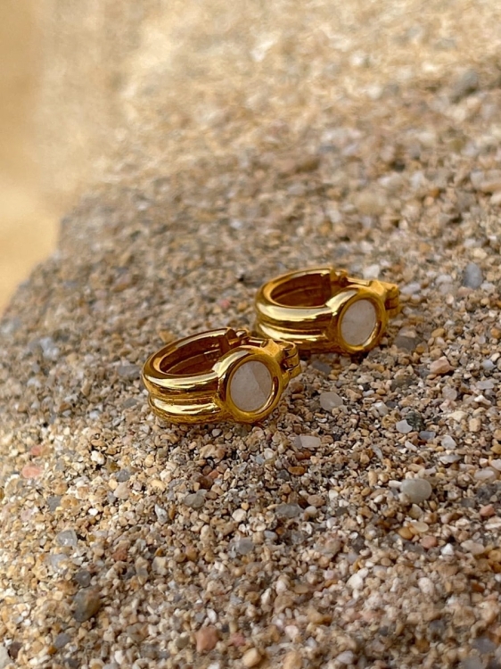 Gold-plated hoop earrings with mountain crystal, close-up detail