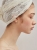 Sterling silver hoop earrings with mountain crystal worn on the ear