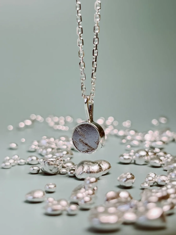 Handmade sterling silver necklace with genuine meteorite