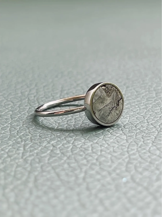 Handcrafted sterling silver ring with raw meteorite, natural texture and inclusions