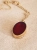 Minimalist gold locket necklace with Baltic amber on a chain
