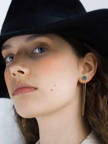 Long gold hanging earrings with natural nephrite