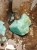 Raw chrysoprase from Poland being cut on diamond saw