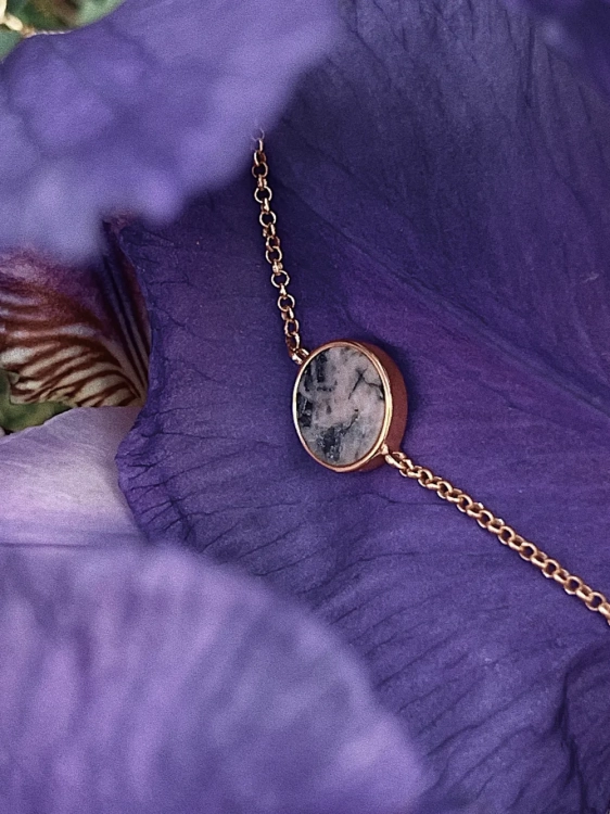 Delicate gold bracelet with blush pink stone detail